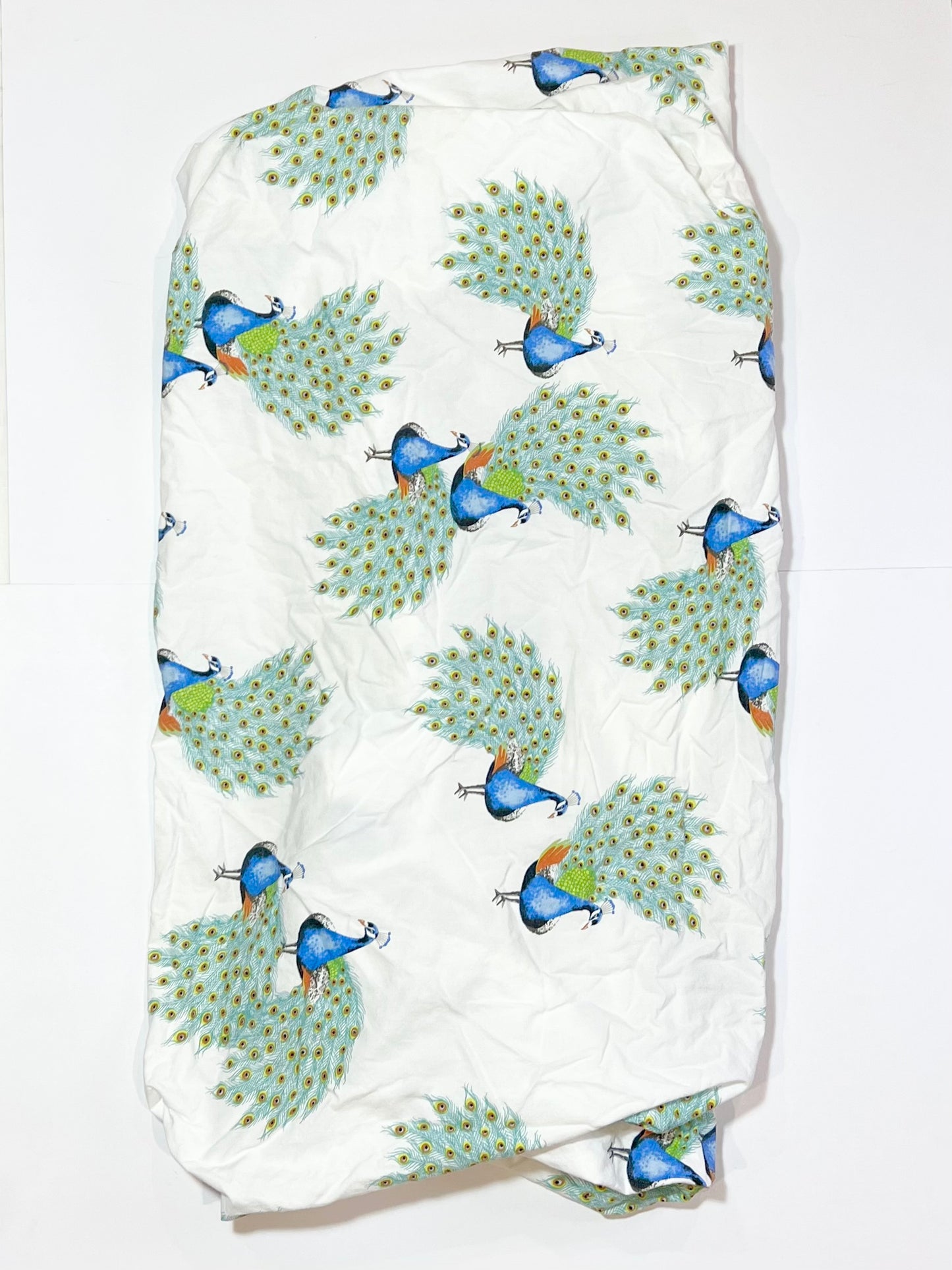 Fitted peacocks cot sheet