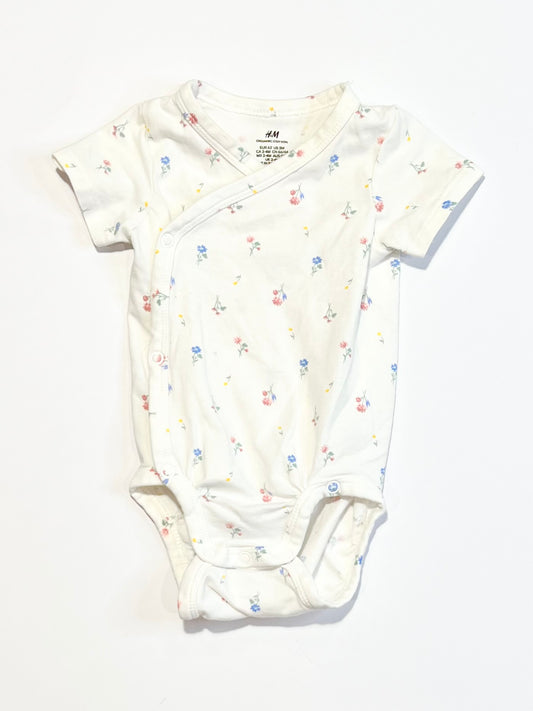 Floral cross-over bodysuit - Size 2-4 months