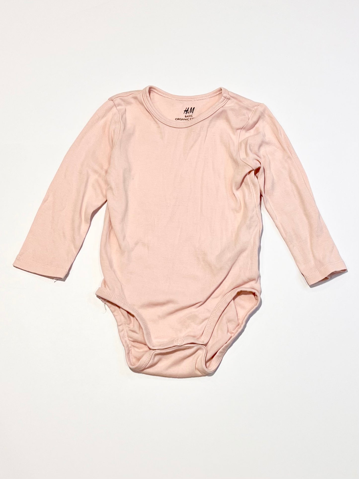 Pink ribbed bodysuit - Size 6-9 months