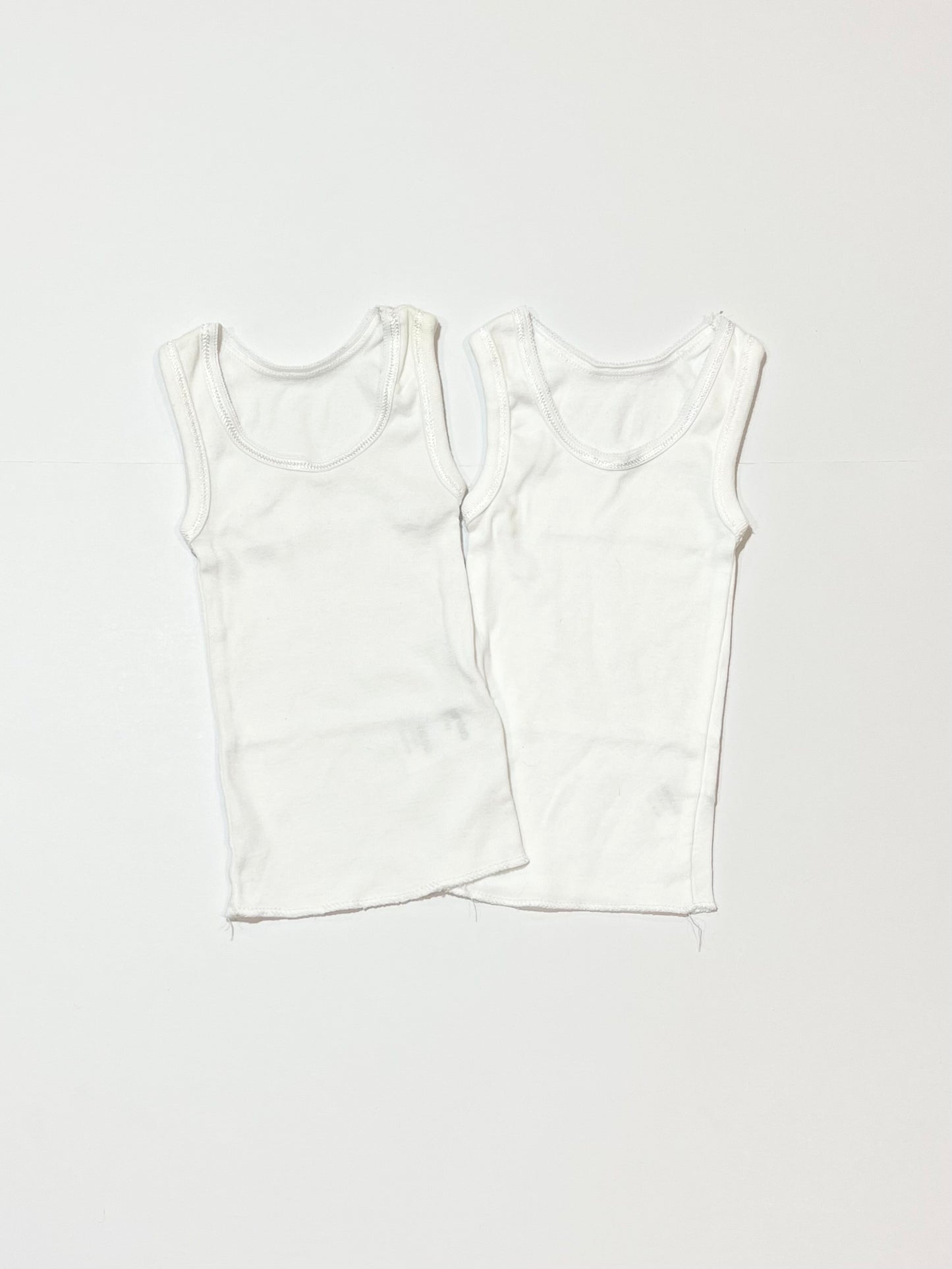 2 x white singlets - Size 0000