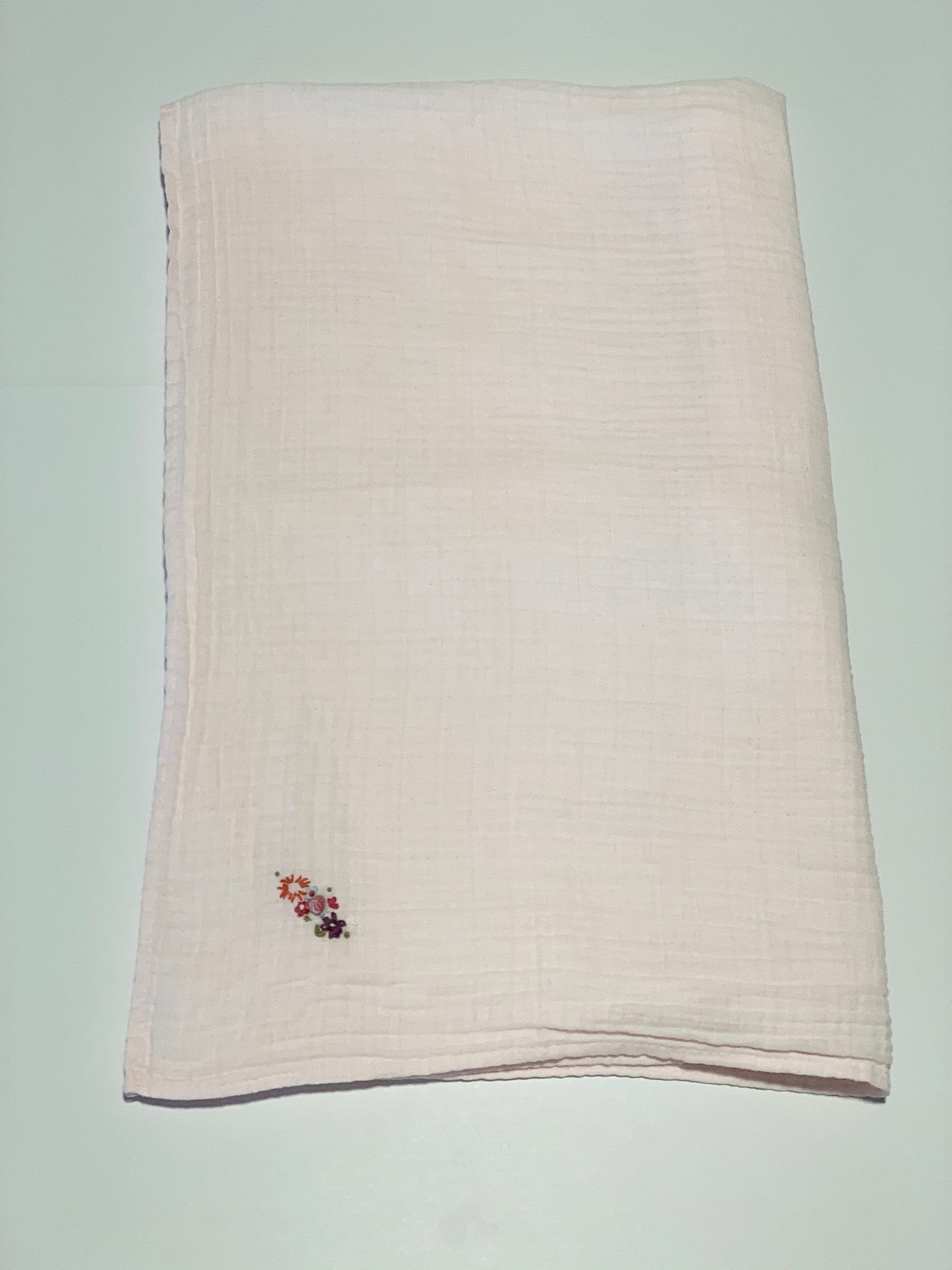Pink embroidered muslin wrap