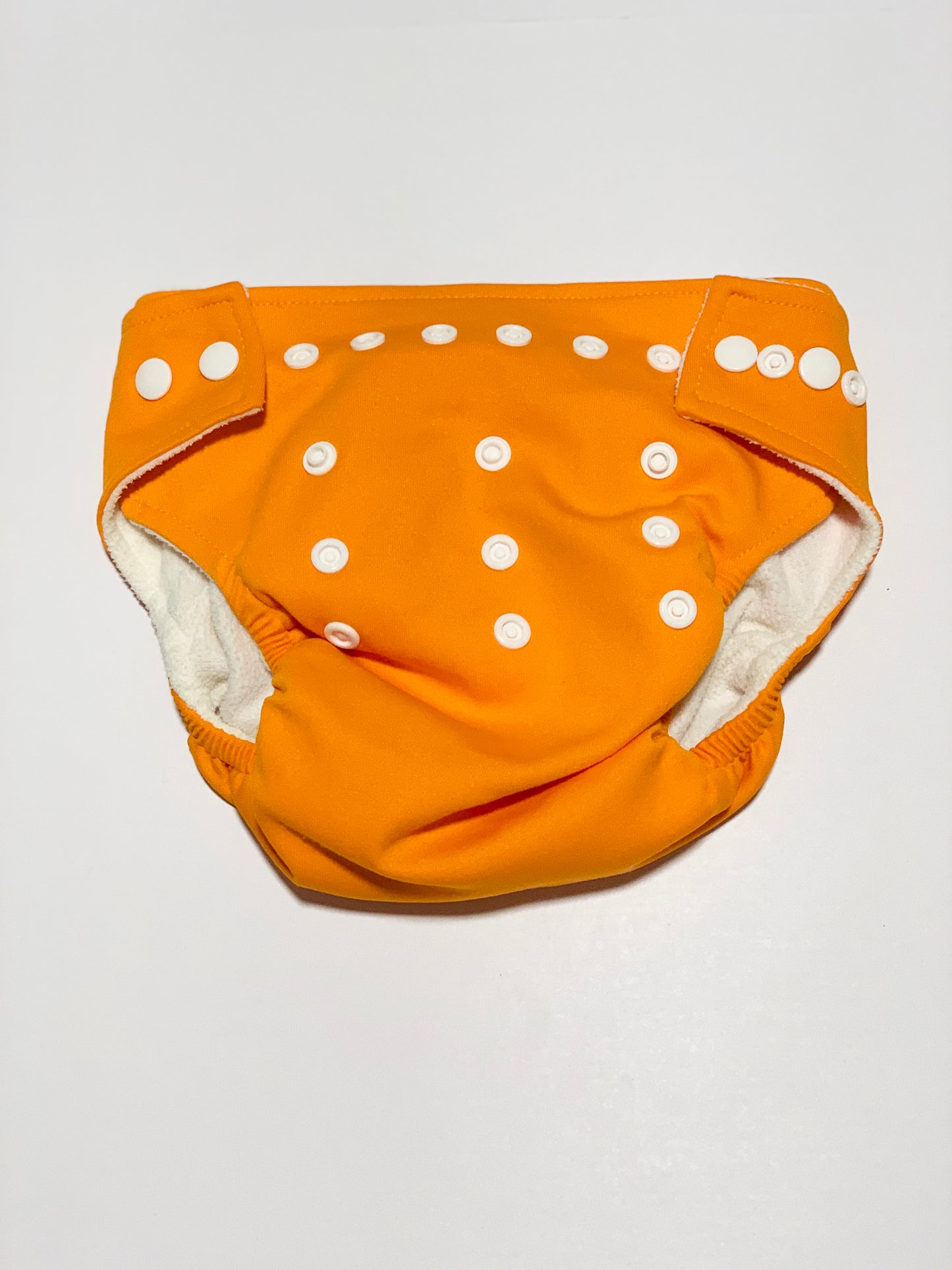 Orange reusable nappy cover