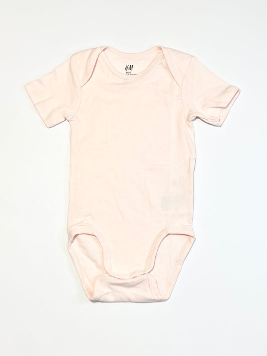 Pink ribbed bodysuit - Size 2
