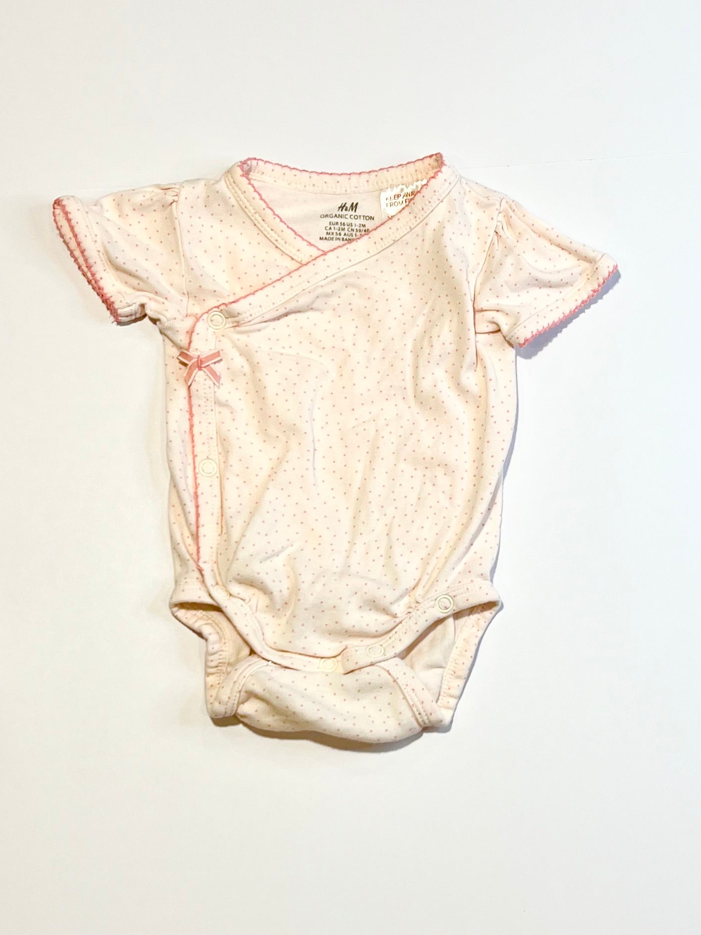 Spotty cross-over bodysuit - Size 1-2 months