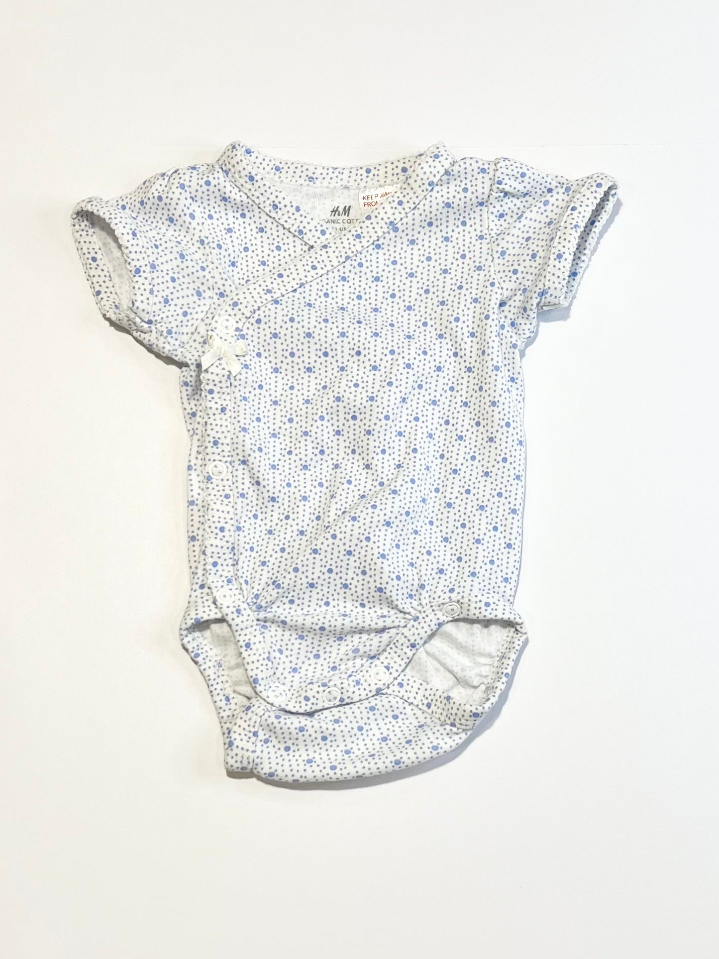 Spotty cross-over bodysuit - Size 2-4 months