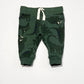 Green dinosaur trackies - Size 000