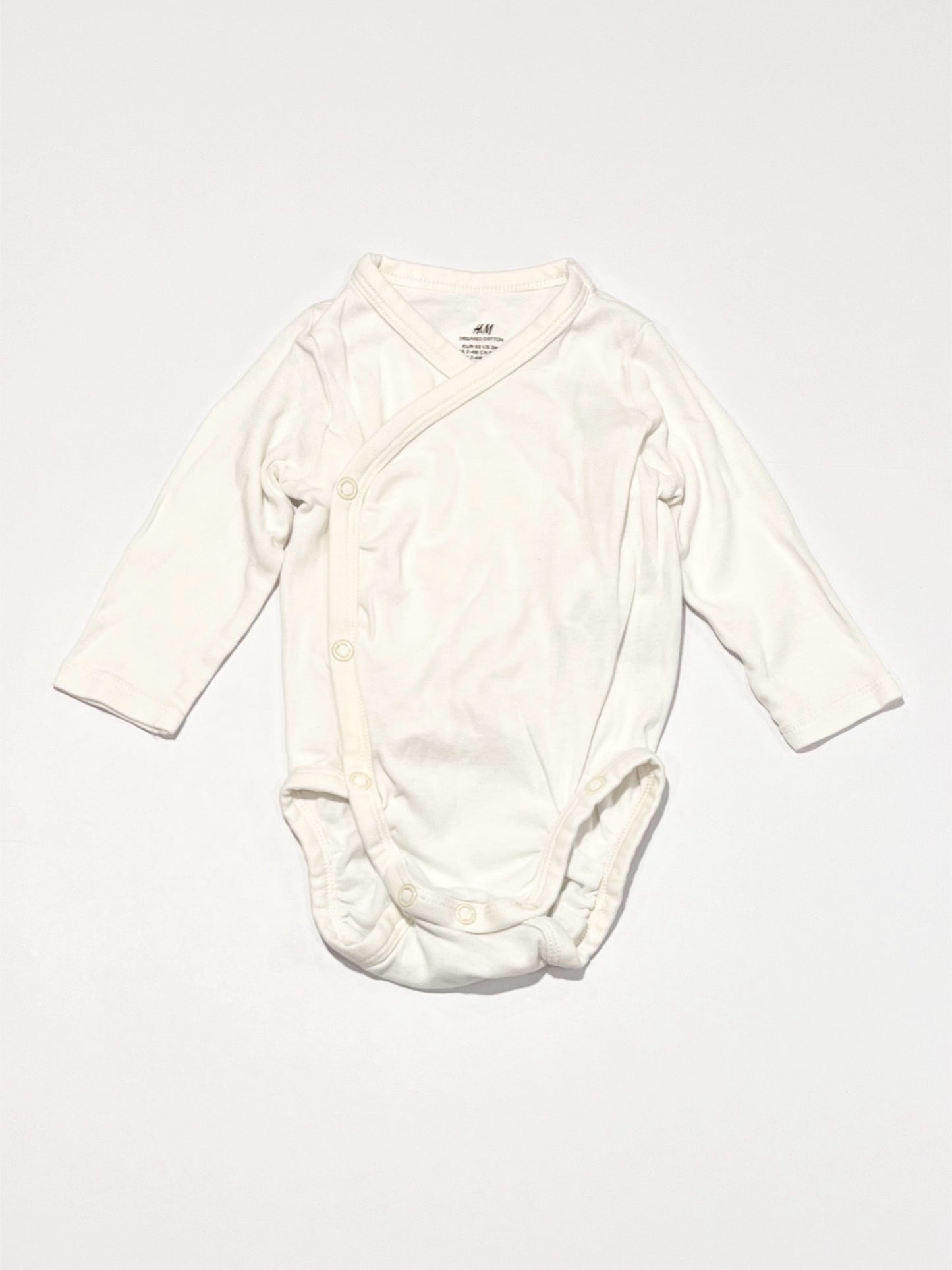 White cross-over bodysuit - Size 2-4 months