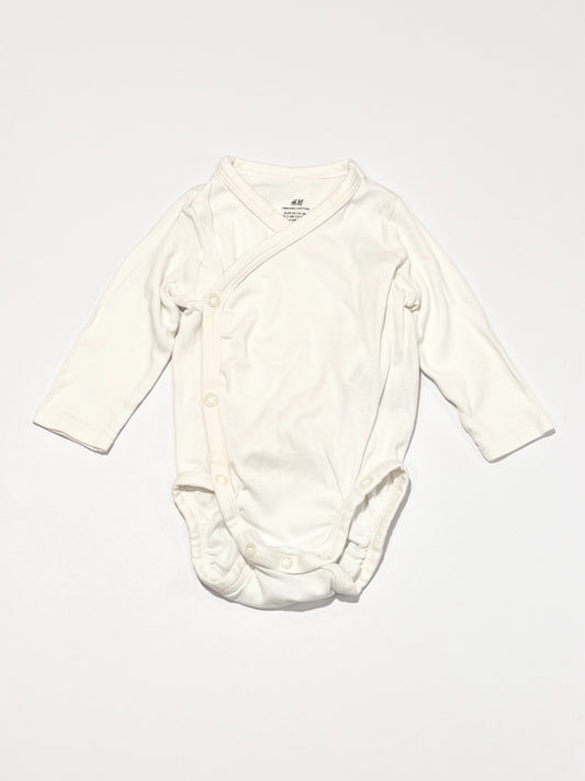 White cross-over bodysuit - Size 2-4 months